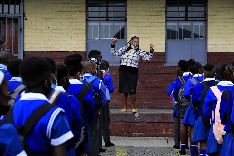 A teacher in front of learners